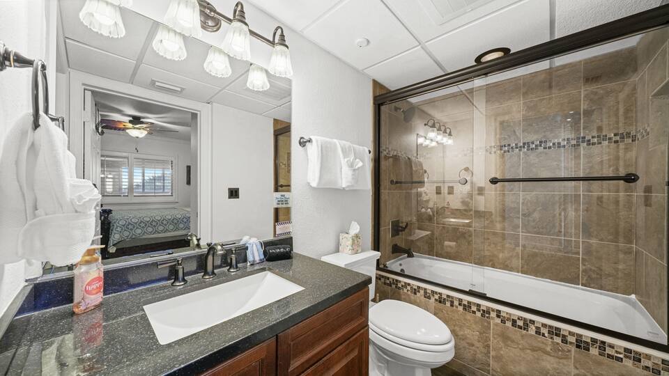 Guest bathroom with tub and shower